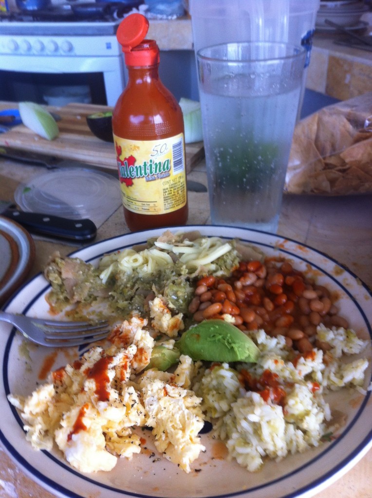 Homemade chilaquiles with tomatillo salsa and more of those pink beans, which even tiny bodegas sell in homey tubs precooked (along with rice, salsa, cabbage salad and guacamole.) Note the Valentina hot sauce, made just up the road in Guadalajara. Like the rest of the hot sauces from the region, it's thick and brick red and made with dried red chiles.