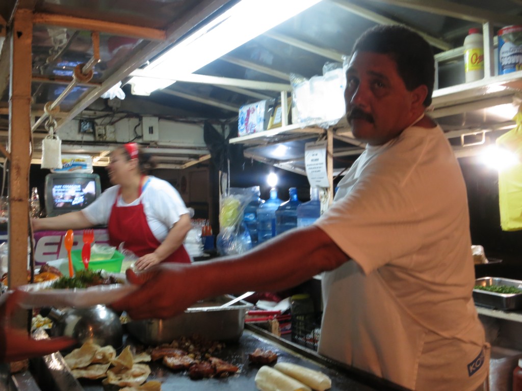 Another view of the same truck. Note the styrofoam tray. Taco trucks in Mexico often use multicolored plastic plates or foam trays but cover them with a small plastic, bag. You eat, remove the bag, then give them bag the plate or tray to reuse.