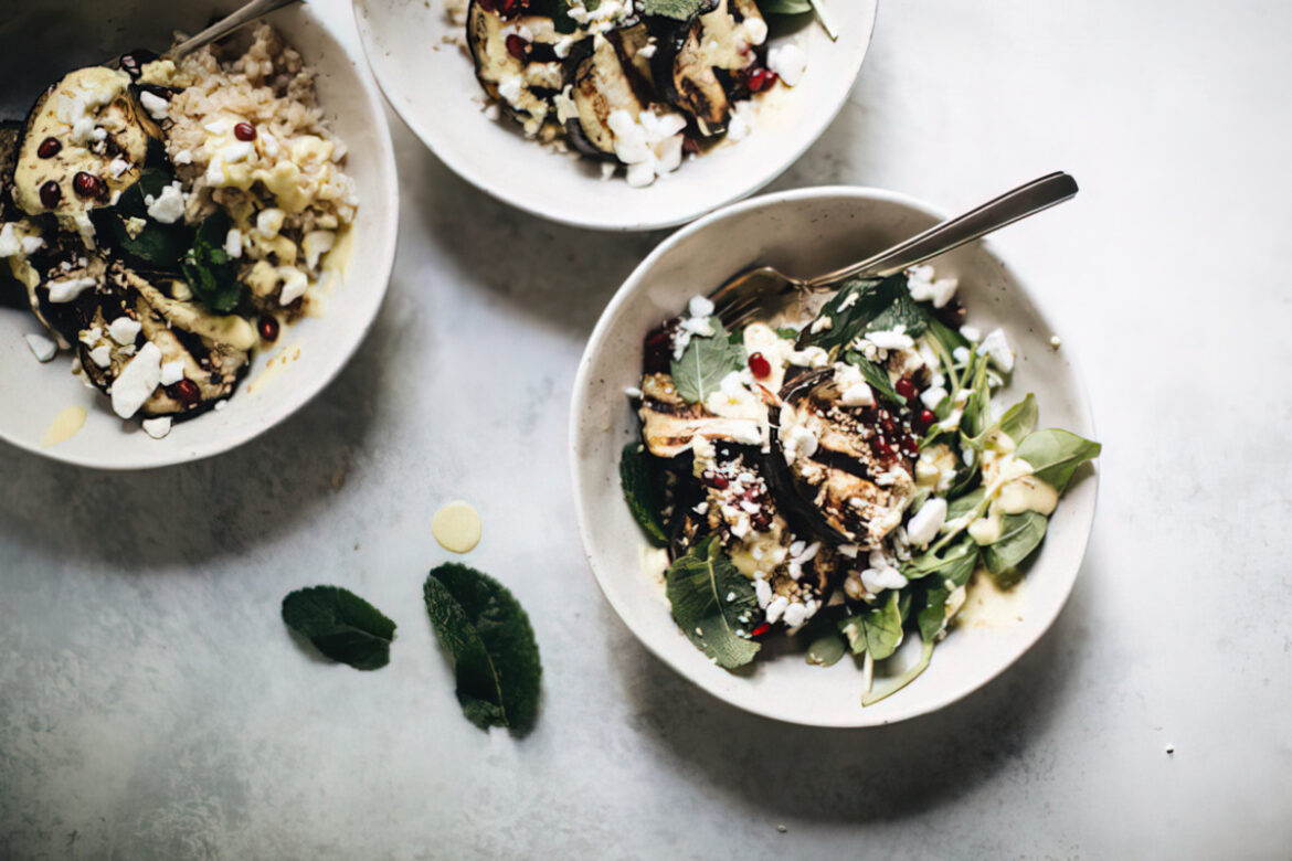 arthur street kitchen eggplant tahini on salad served in white bowls
