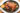 roasted chicken dinner with veggies and lemon in cast iron pan
