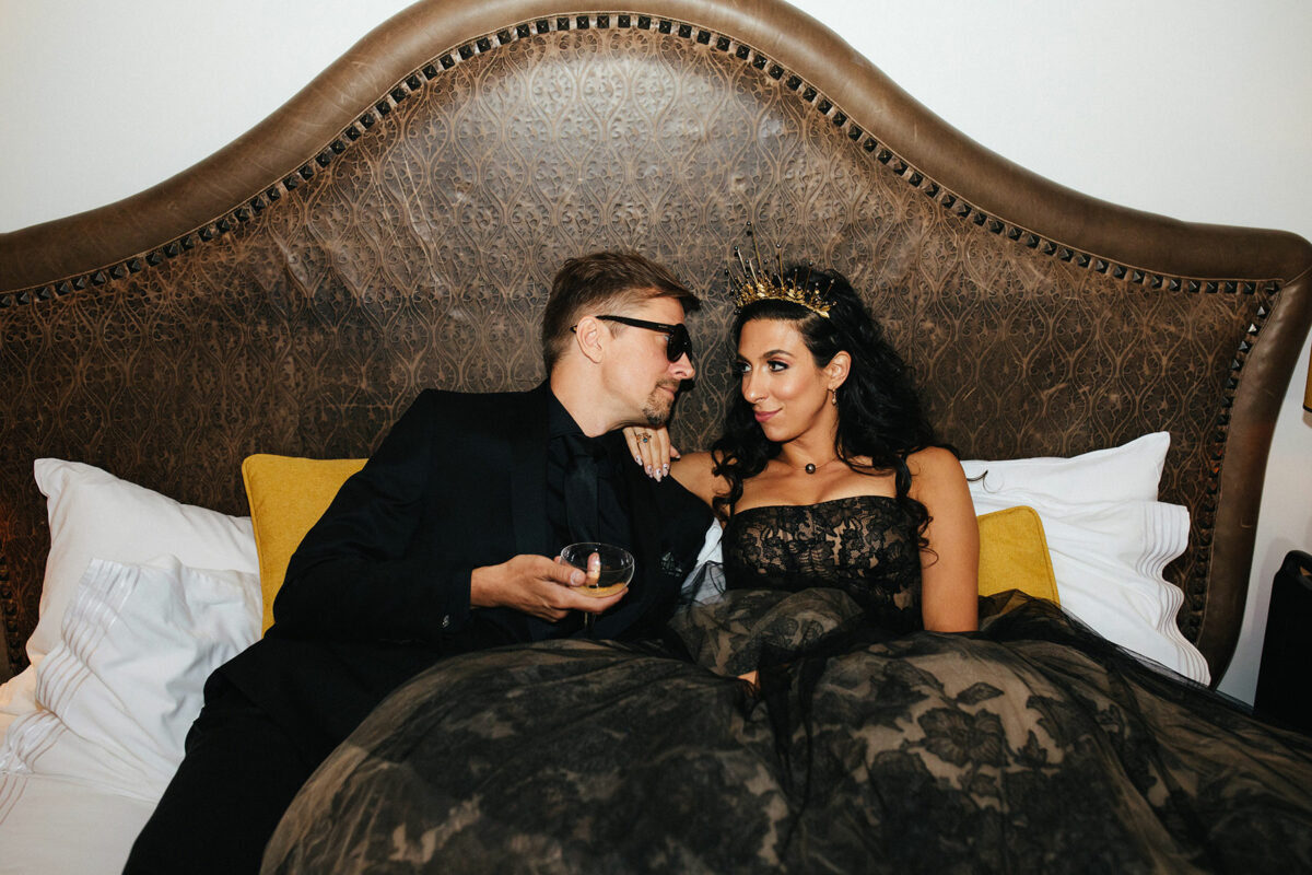 couple in bed in fancy clothes