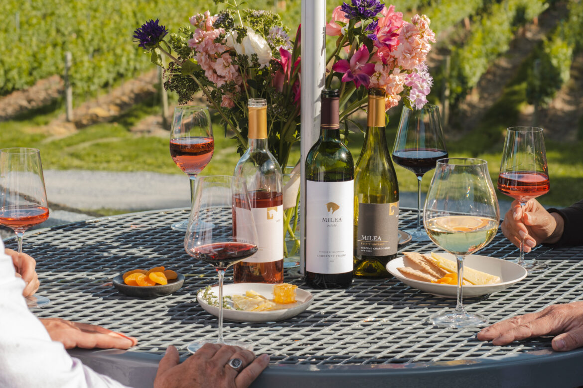a summer table featuring milea estate vineyard wine