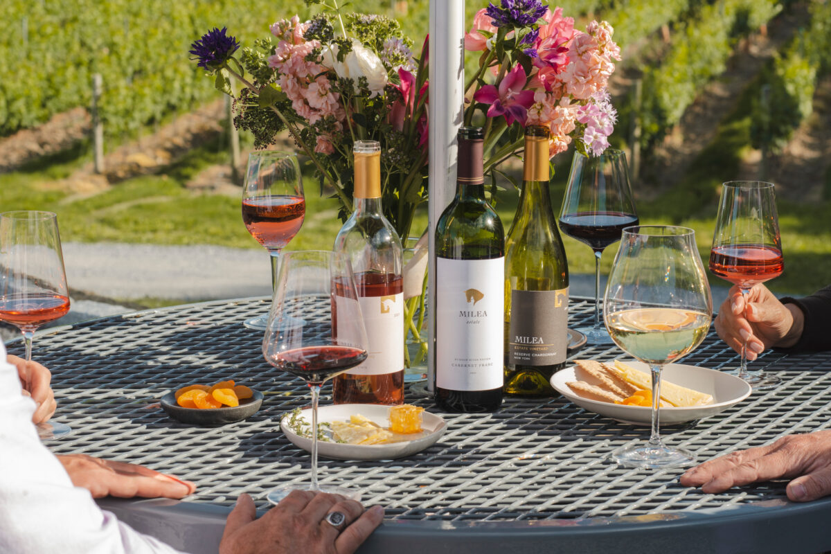 a summer table featuring milea estate vineyard wine